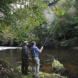 The Ghille gives fishing lessons